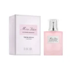 Miss Dior Blooming Bouquet perfume bottle with a pink box beside it, white label on bottle and silver spray cap