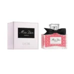 Miss Dior Essence perfume bottle with pink fragrance and black bow beside a white box labeled Miss Dior Essence and Dior
