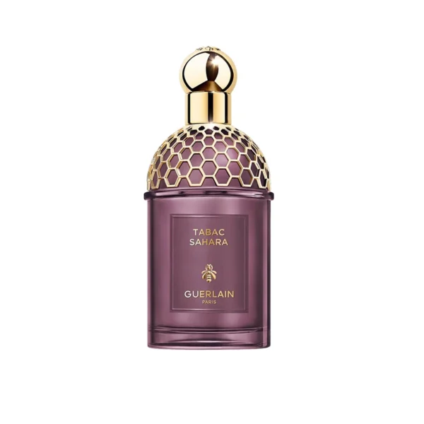 Guerlain Tabac Sahara perfume bottle with purple glass and a gold honeycomb-pattern cap on a white background.