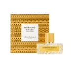Bottle of Morning Chess perfume beside a patterned orange box with a white label reading Morning Chess, Vilhelm Parfumerie, New York, eau de parfum (100 ml).