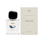 Clear glass perfume bottle with a chunky black cap, labeled DIVINE, shown next to its beige box.